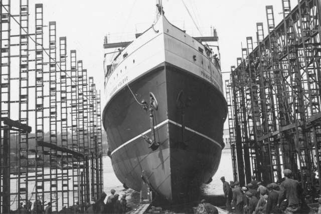 Historic ship under construction in a shipyard